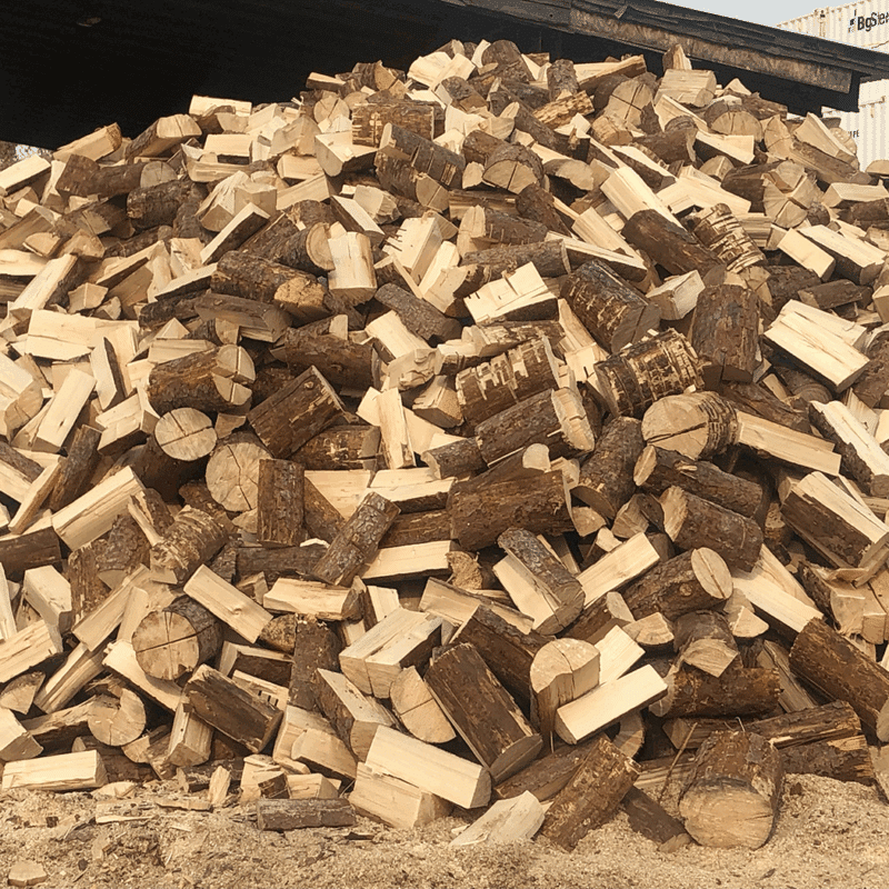 Cord of pine firewood stacked neatly, available for purchase 24/7, showcasing its natural texture and color.