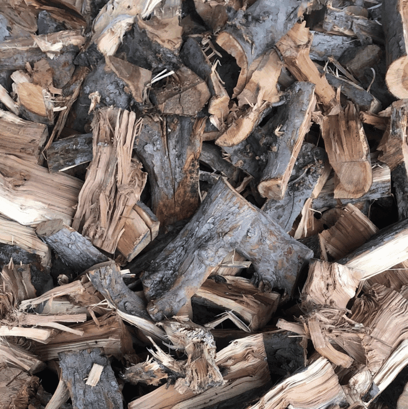 Firewood display featuring multiple cords of apple wood, available for purchase 24/7.